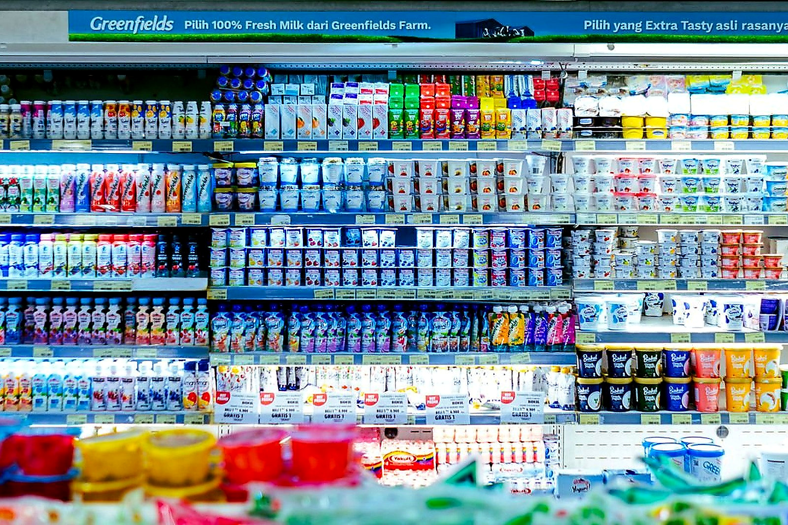 Free Vibrant shelves of diverse dairy products in a West Java supermarket. Stock Photo